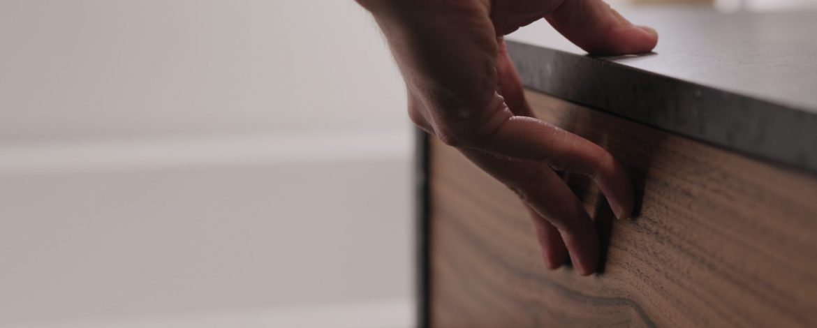 man hand open and close batroom cabinet drawer closeup, wide photo