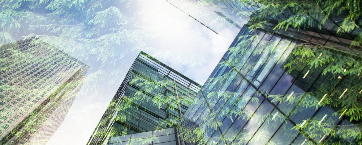 green city - double exposure of lush green forest and modern skyscrapers windows